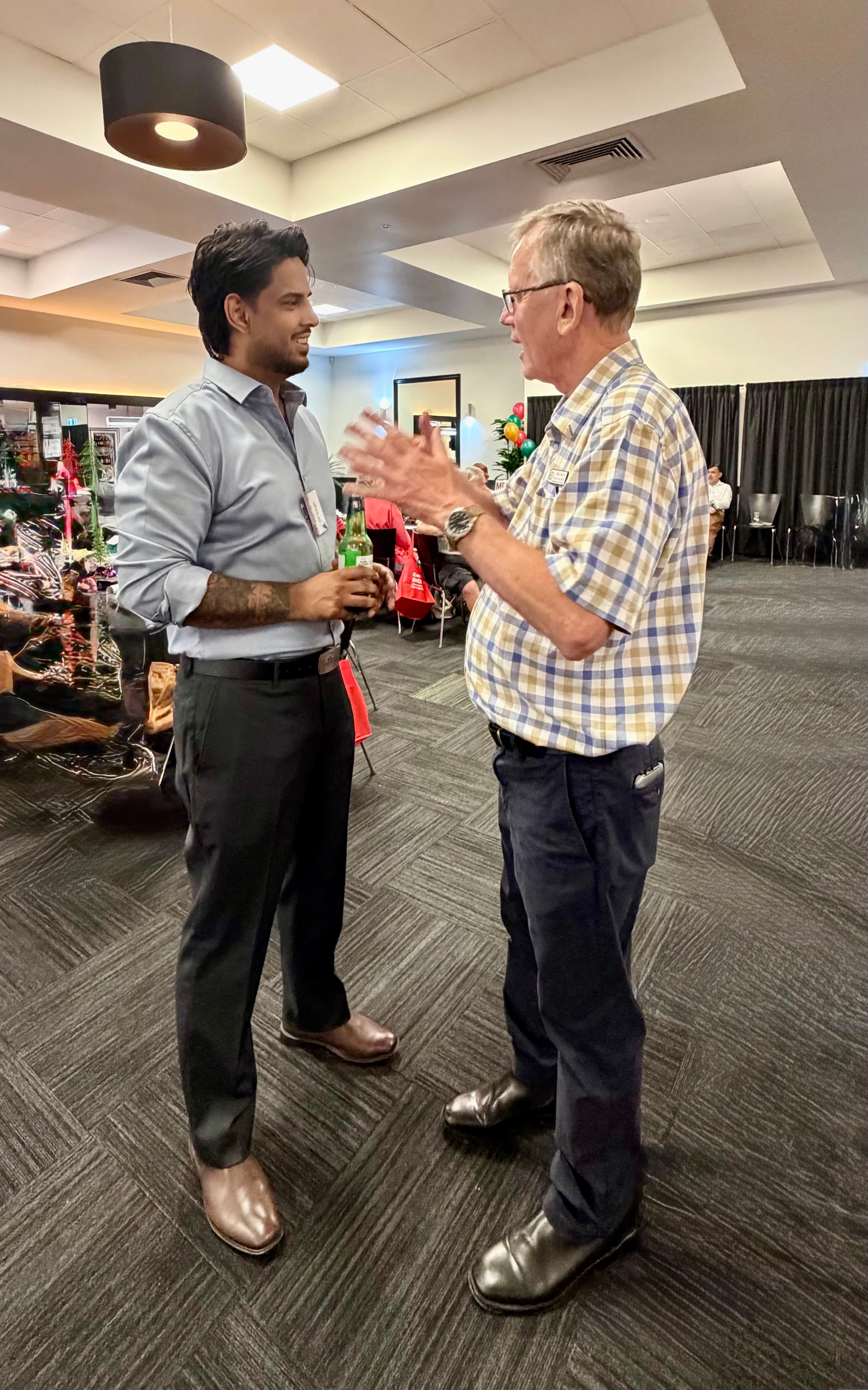 In conversation at a Logan community event, discussing local development, opportunity, and the issues that shape everyday public life.
